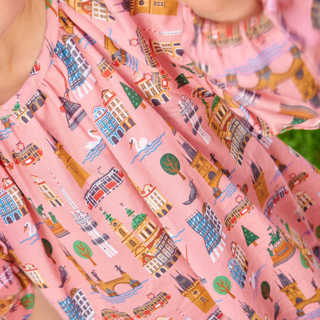 Cotton girls' dress Bella with Prague pattern, perfect for casual wear. Dívčí bavlněné šaty Bella s  vzorem Praha, ideální na každodenní nošení