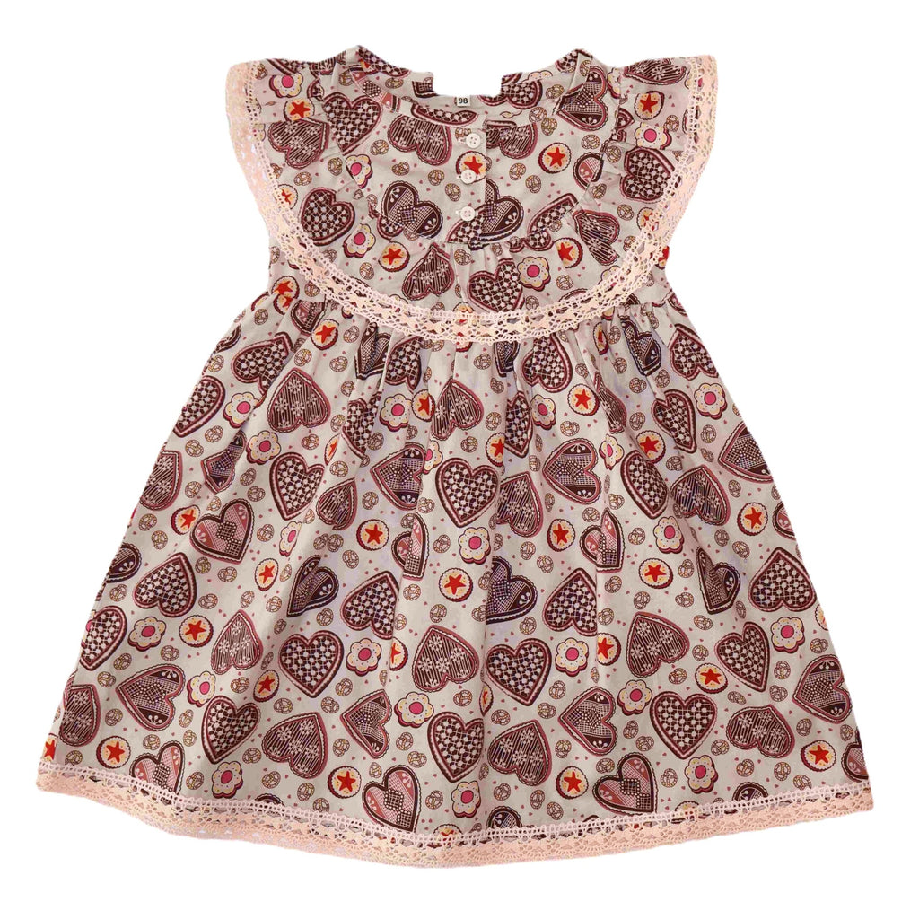 Girls' cotton dress Ginger, inspired by Czech gingerbread patterns, perfect for Christmas. Dívčí bavlněné šaty Perníček, inspirované vzory českého perníku, ideální na Vánoce, vyrobené z vysoce kvalitních švýcarských látek.